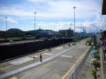 The tugs start again. The ship in the western lock flight (behind) is carrying wind turbine blades.